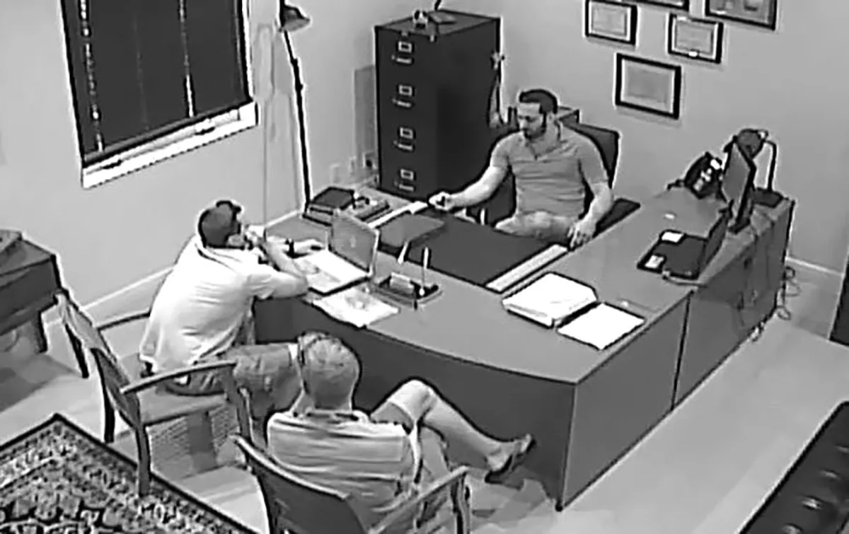 Original surveillance still · Bahamas brokerage office